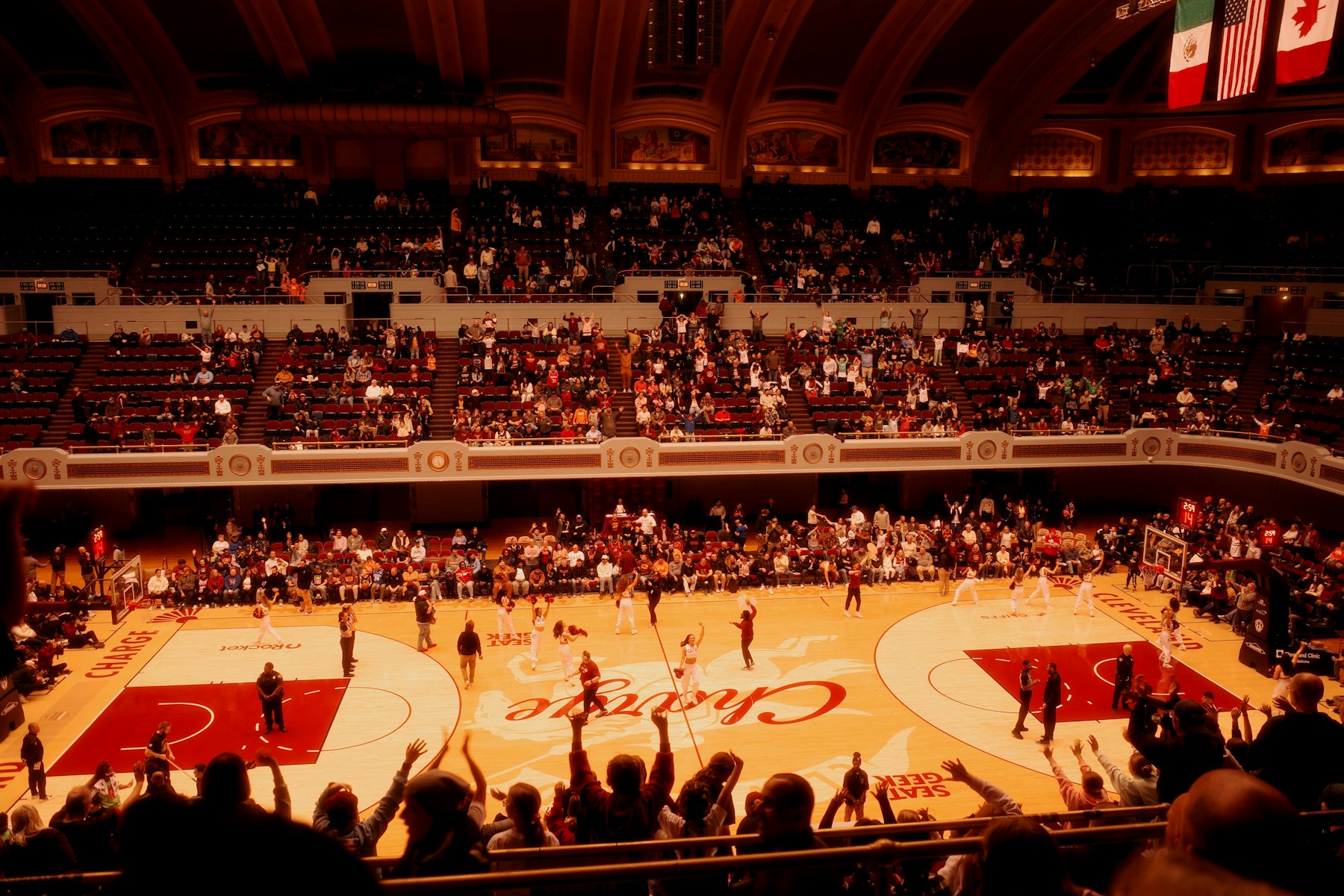 Basketball arena lit during a dramatic scoring sequence